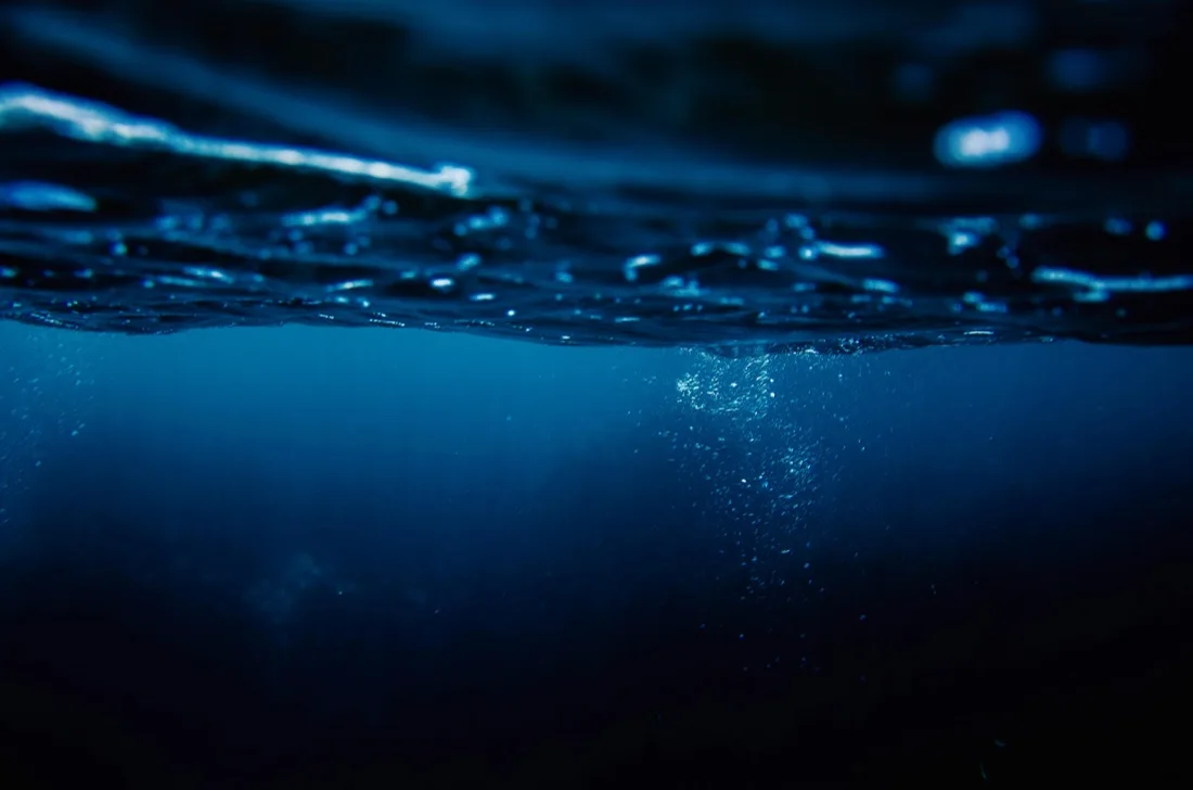 A packaged product submerged in the ocean depths, illustrating HPP high-pressure preservation